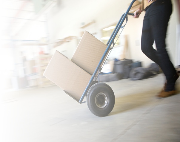 Worker Pushing Hand Truck