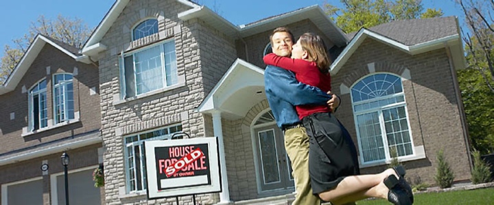 Man and Woman Hugging After Buying Dream Home