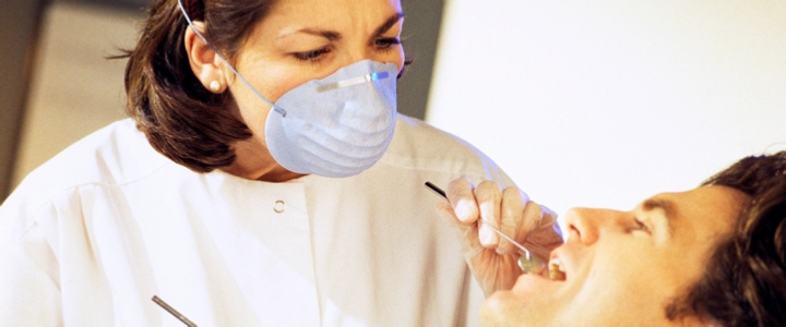 Dentist Checking Man's Teeth